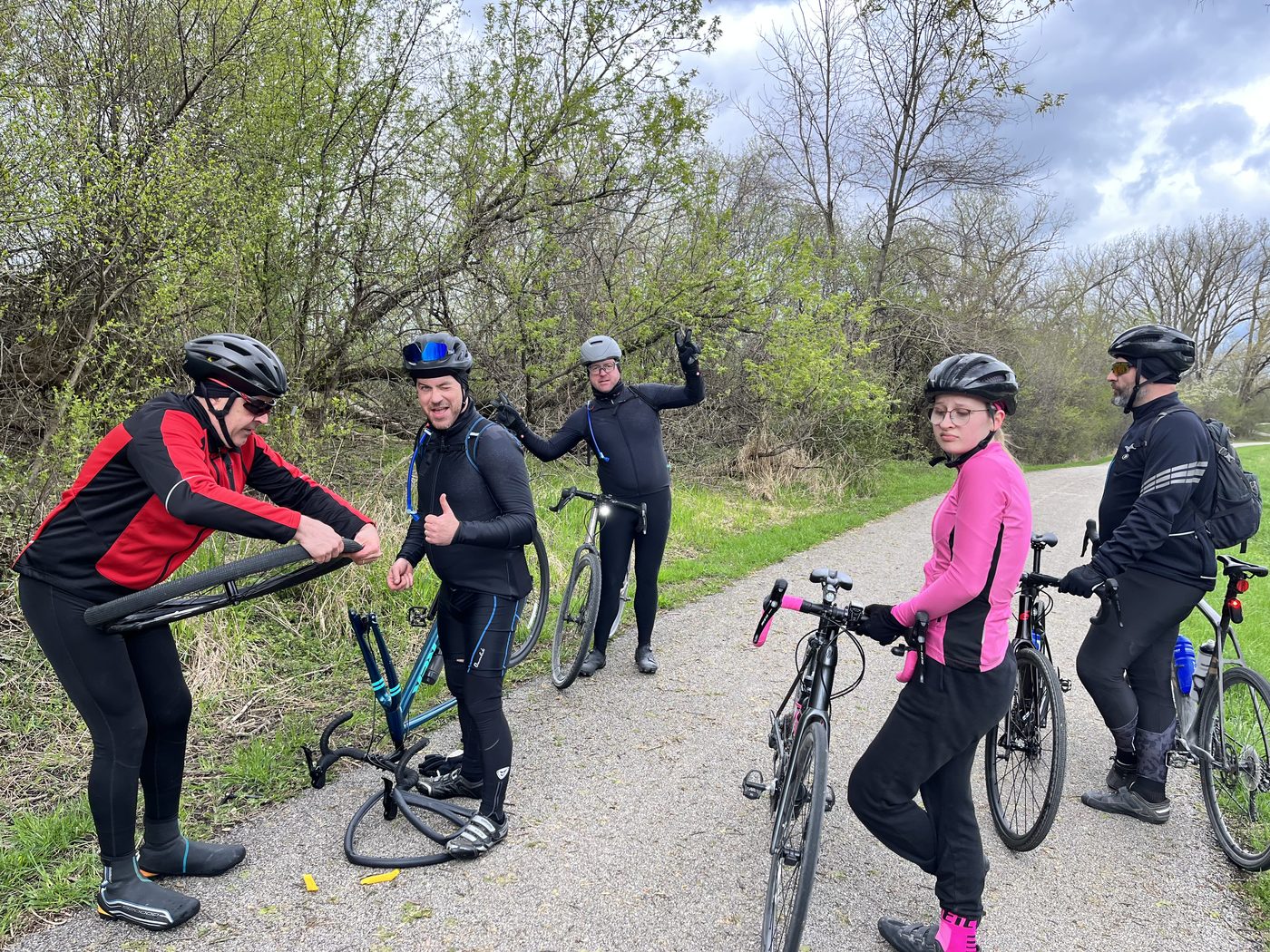 Group fixing a flat on the trail